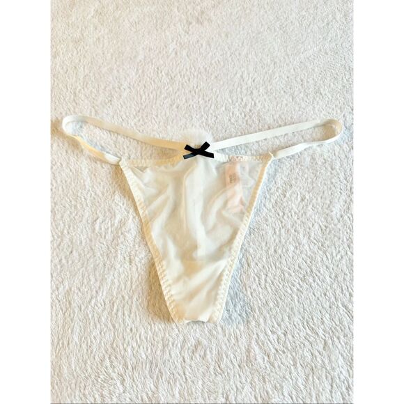 White sheer Victoria’s Secret thong new with tags with black bow detail and pom- - Picture 6 of 6